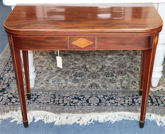 A George III inlaid mahogany tea table W.91cm